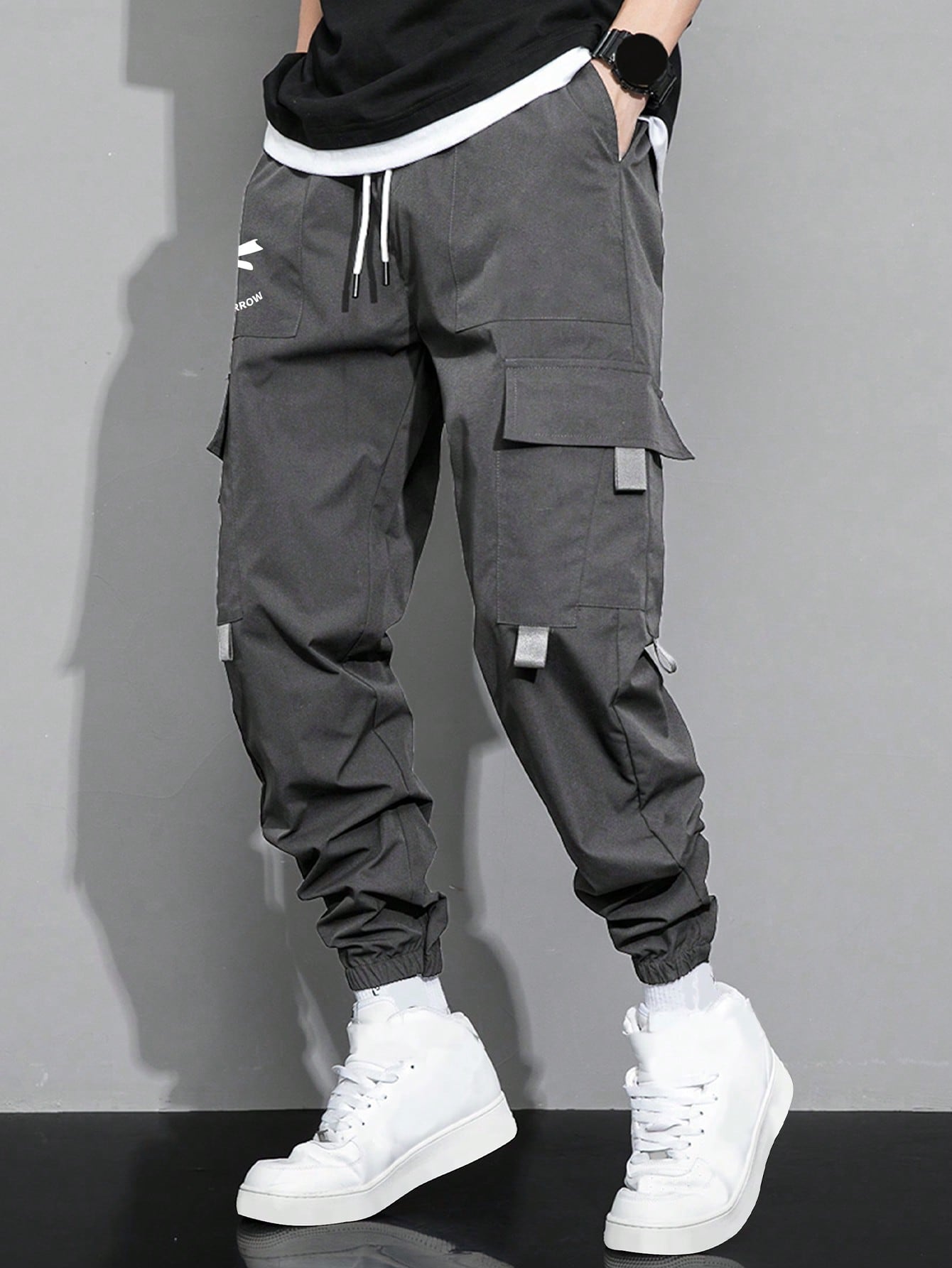 Manfinity Hypemode Loose Fit Men's Cargo Pants With Slogan Graphic, Flap Pocket, And Drawstring Waist