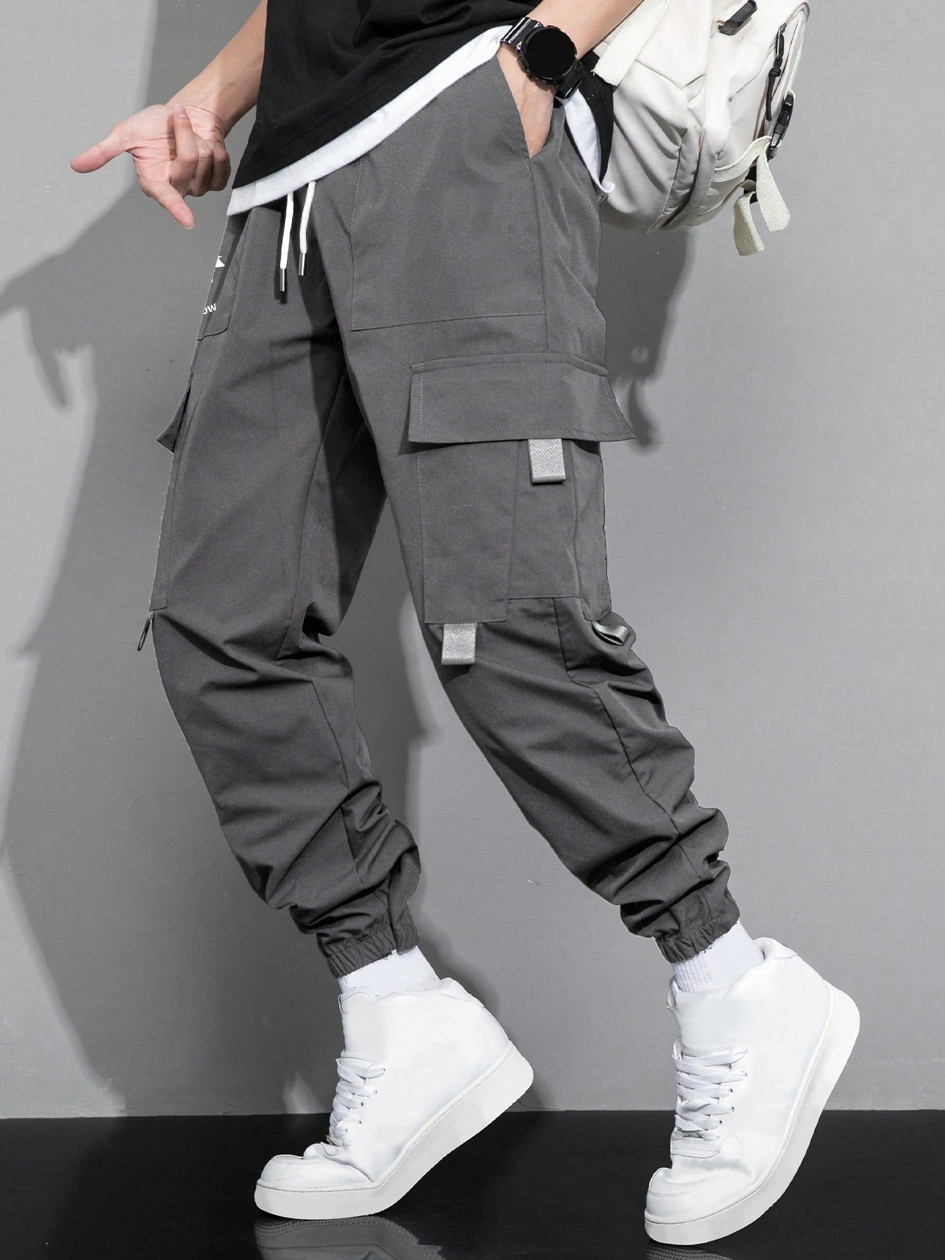 Manfinity Hypemode Loose Fit Men's Cargo Pants With Slogan Graphic, Flap Pocket, And Drawstring Waist